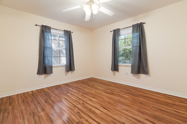 empty room with wood-type flooring and ceiling fan