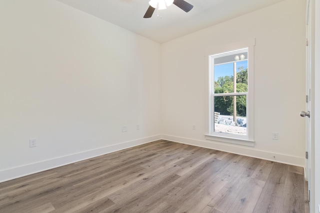 unfurnished room with ceiling fan and light hardwood / wood-style floors