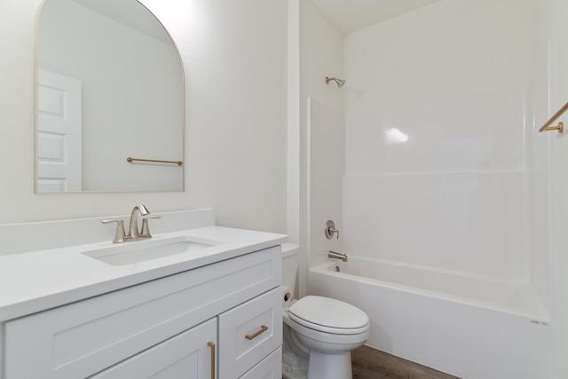 full bathroom featuring shower / tub combination, vanity, toilet, and hardwood / wood-style floors