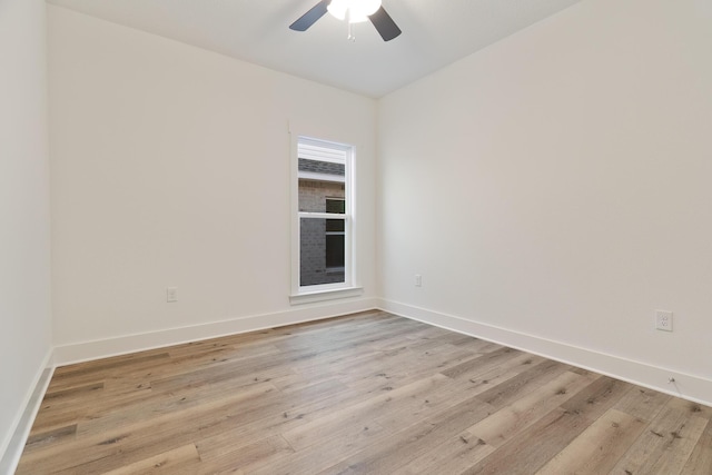 empty room featuring ceiling fan and light wood-type flooring