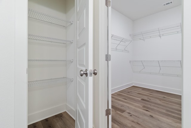 spacious closet featuring wood-type flooring