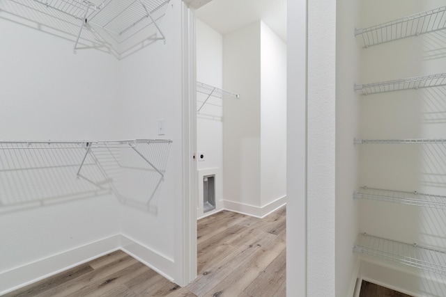 walk in closet featuring light wood-type flooring