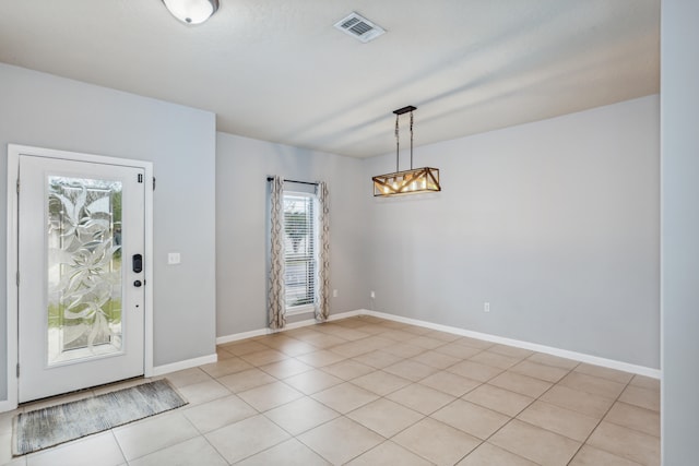 foyer entrance featuring light tile patterned floors