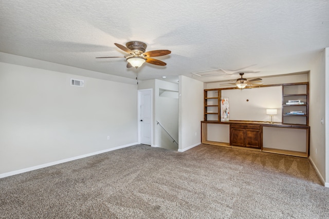 unfurnished living room featuring a textured ceiling, carpet, and ceiling fan