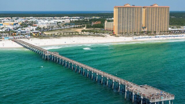 birds eye view of property with a view of the beach and a water view