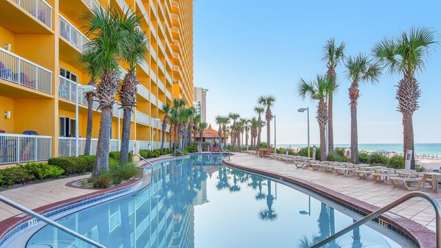 view of pool with a water view