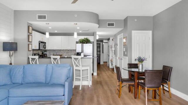 living room with light hardwood / wood-style flooring