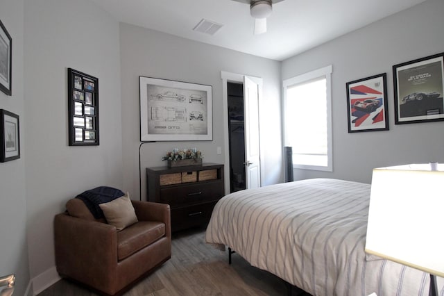 bedroom featuring ceiling fan and dark hardwood / wood-style flooring