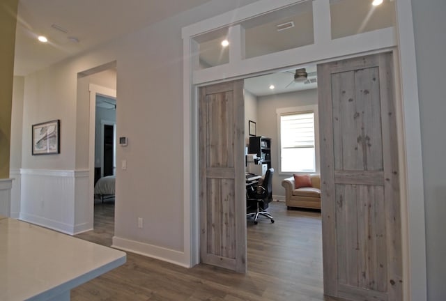 corridor featuring hardwood / wood-style flooring