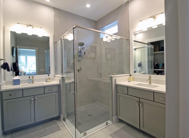 bathroom featuring vanity, tile patterned floors, and an enclosed shower