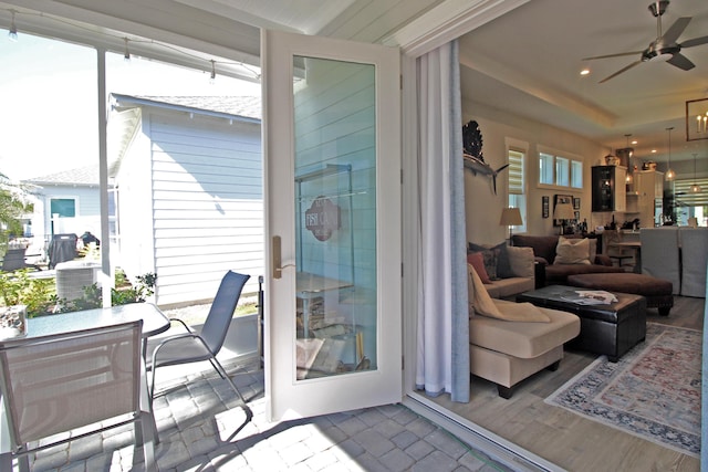 sunroom with ceiling fan and a wealth of natural light