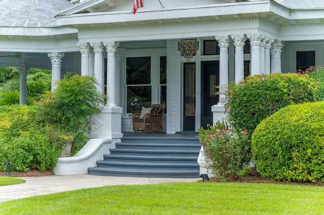 doorway to property featuring covered porch