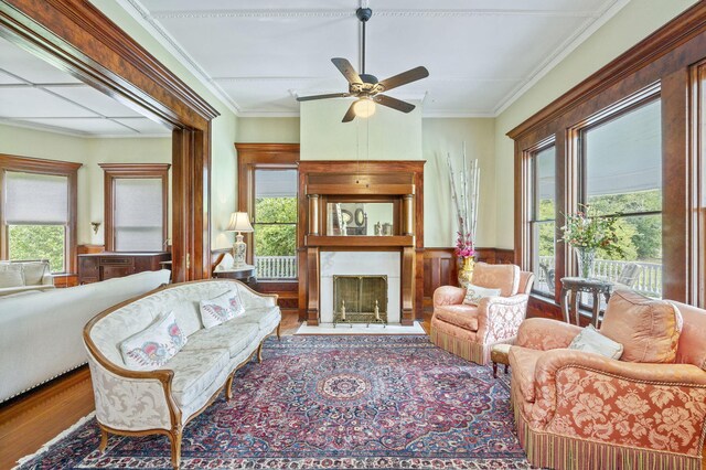 living room with a healthy amount of sunlight, ceiling fan, and wood-type flooring