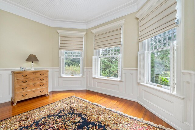 doorway to outside featuring ornamental molding, hardwood / wood-style floors, and a wealth of natural light