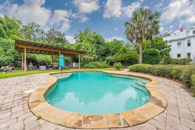 view of swimming pool featuring a pergola and a patio area