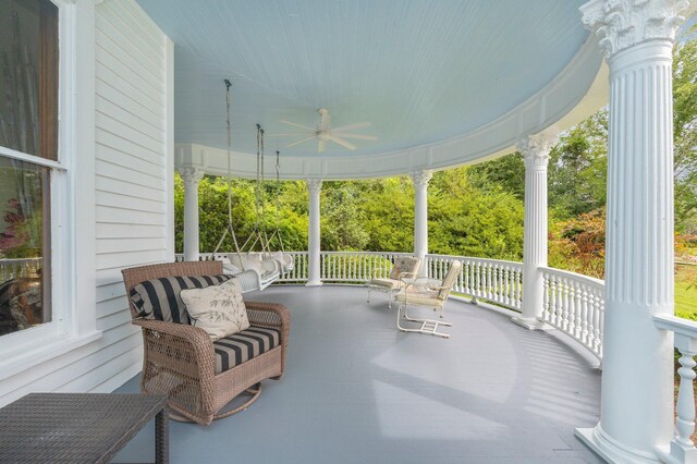 view of patio featuring ceiling fan and a porch