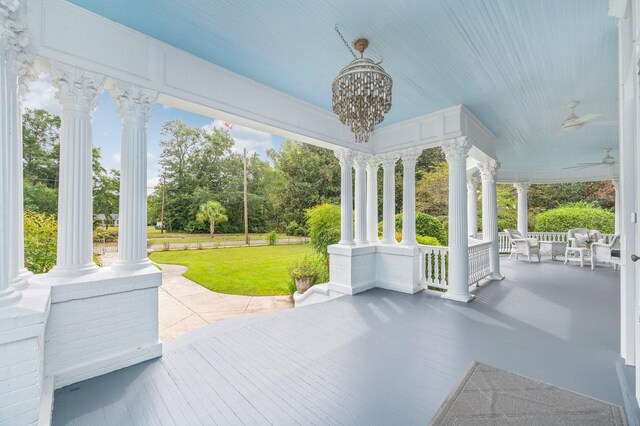 view of patio / terrace with ceiling fan and a porch