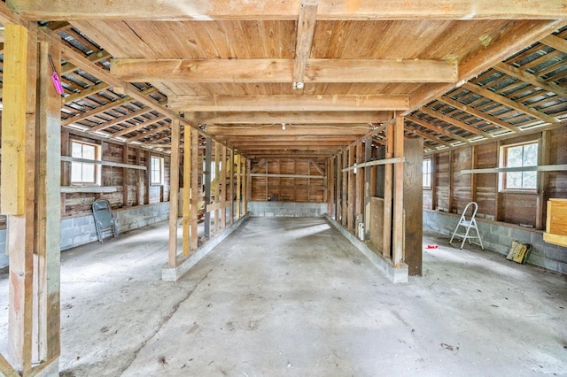 misc room featuring concrete flooring and a wealth of natural light