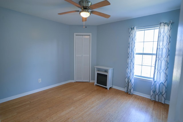 unfurnished room with ceiling fan and light hardwood / wood-style flooring