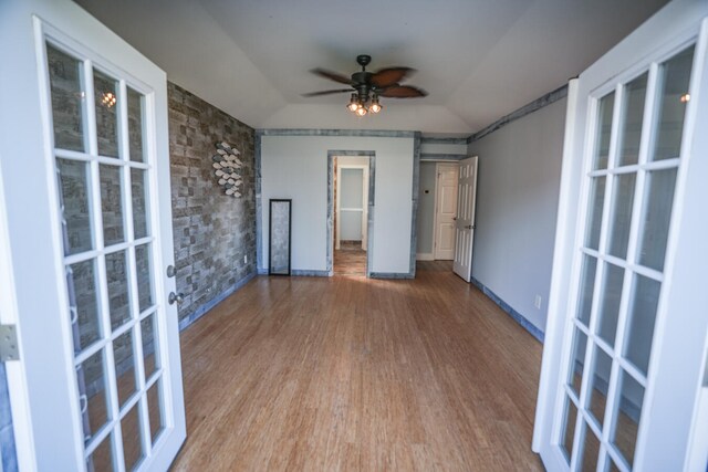 unfurnished room with vaulted ceiling, ceiling fan, and hardwood / wood-style floors