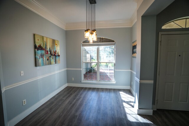 unfurnished dining area with a notable chandelier, crown molding, and dark hardwood / wood-style flooring