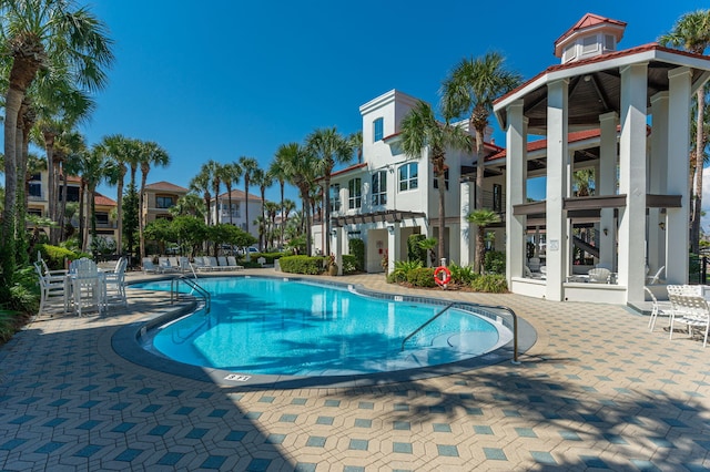 view of swimming pool with a patio area