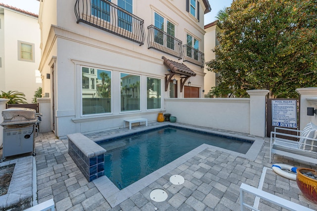 view of pool with grilling area