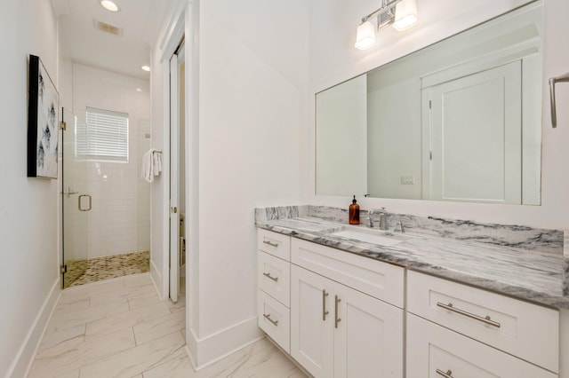 bathroom featuring vanity and walk in shower