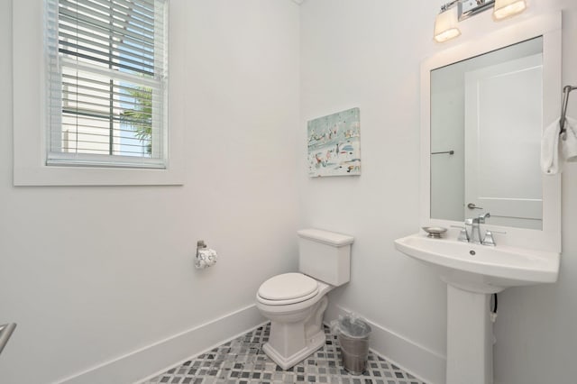 bathroom with tile patterned floors and toilet