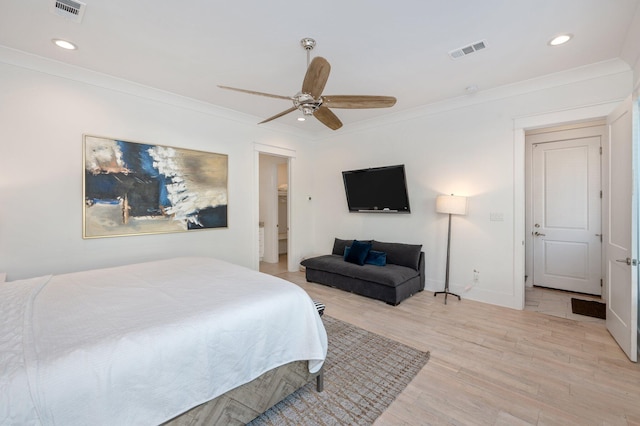 bedroom with light hardwood / wood-style flooring, ceiling fan, and ornamental molding