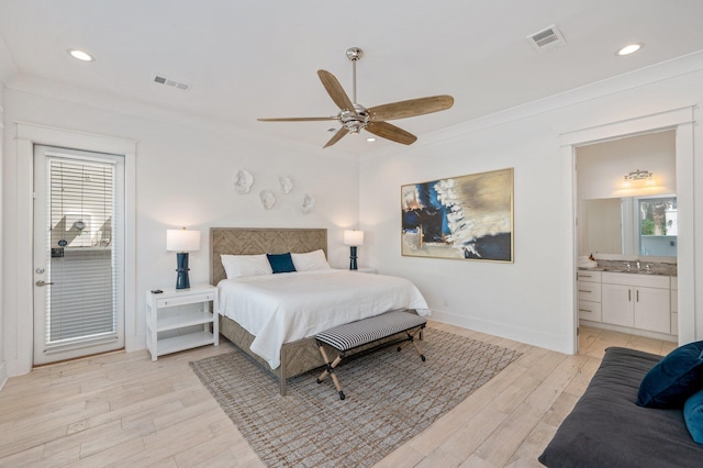 bedroom featuring crown molding, sink, light hardwood / wood-style flooring, ceiling fan, and connected bathroom