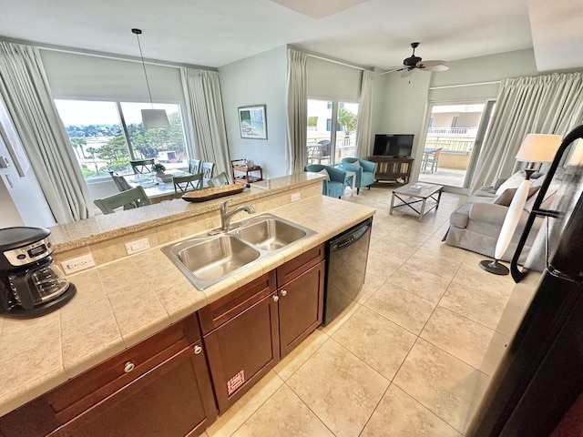 5002 S Sandestin Blvd # 6322, Miramar Beach, FL 32550 - kitchen featuring black dishwasher, a ceiling fan, light tile patterned floors, tile counters, and decorative light fixtures