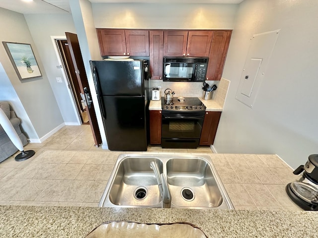 5002 S Sandestin Blvd # 6322, Miramar Beach, FL 32550 - kitchen featuring black appliances, decorative backsplash, electric panel, and light tile patterned floors