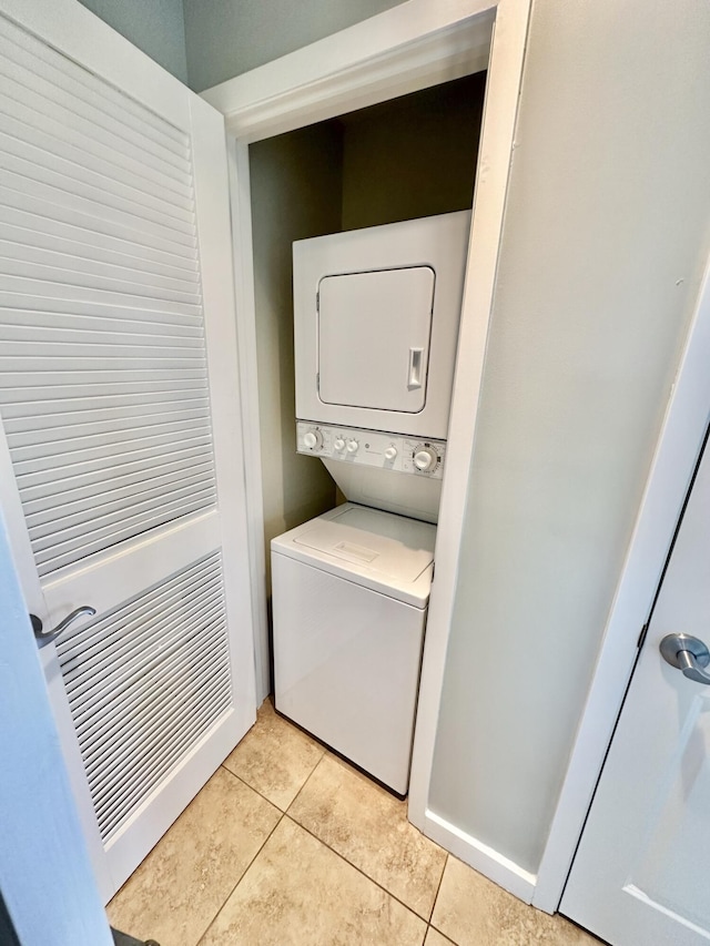 5002 S Sandestin Blvd # 6322, Miramar Beach, FL 32550 - laundry room featuring stacked washer and clothes dryer and light tile patterned floors