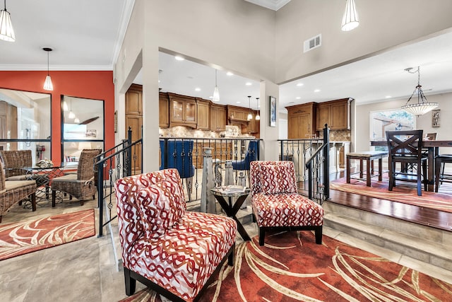 living room with lofted ceiling and crown molding