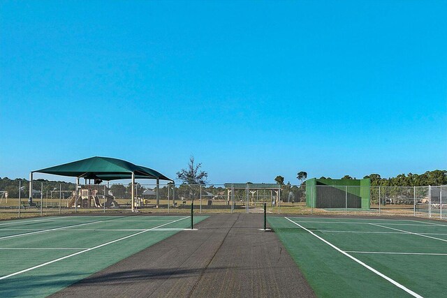 view of sport court with a playground