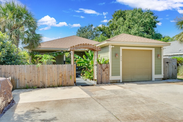 view of front facade with an outbuilding and a garage