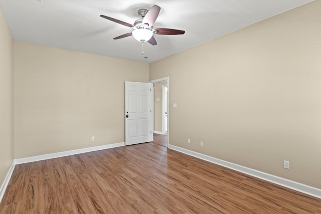 spare room with ceiling fan and hardwood / wood-style floors