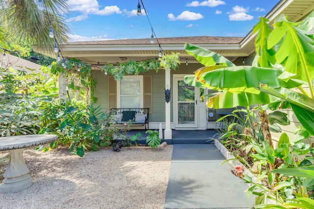 property entrance with covered porch