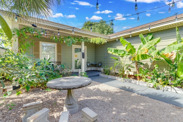 entrance to property with a patio