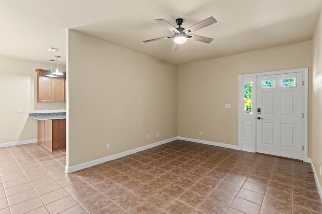 tiled entrance foyer with ceiling fan