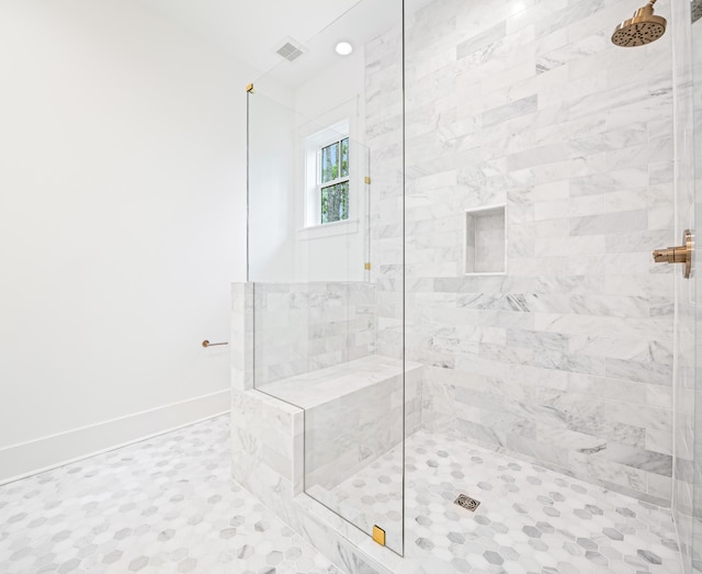 bathroom with a tile shower