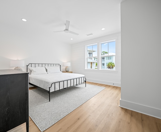 bedroom featuring light hardwood / wood-style floors and ceiling fan