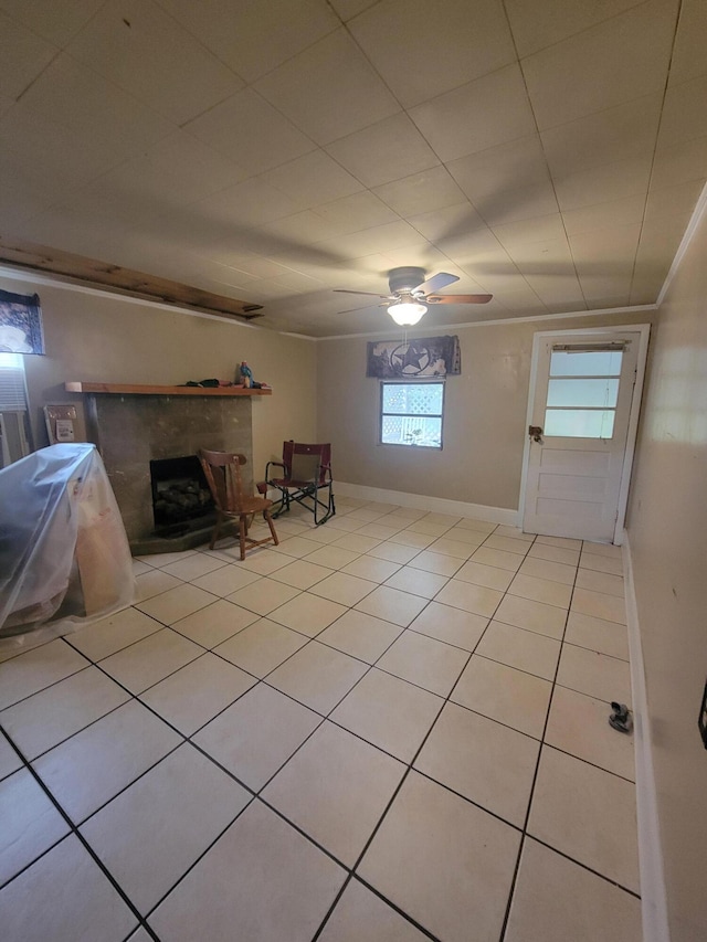 interior space with light tile patterned floors and ceiling fan