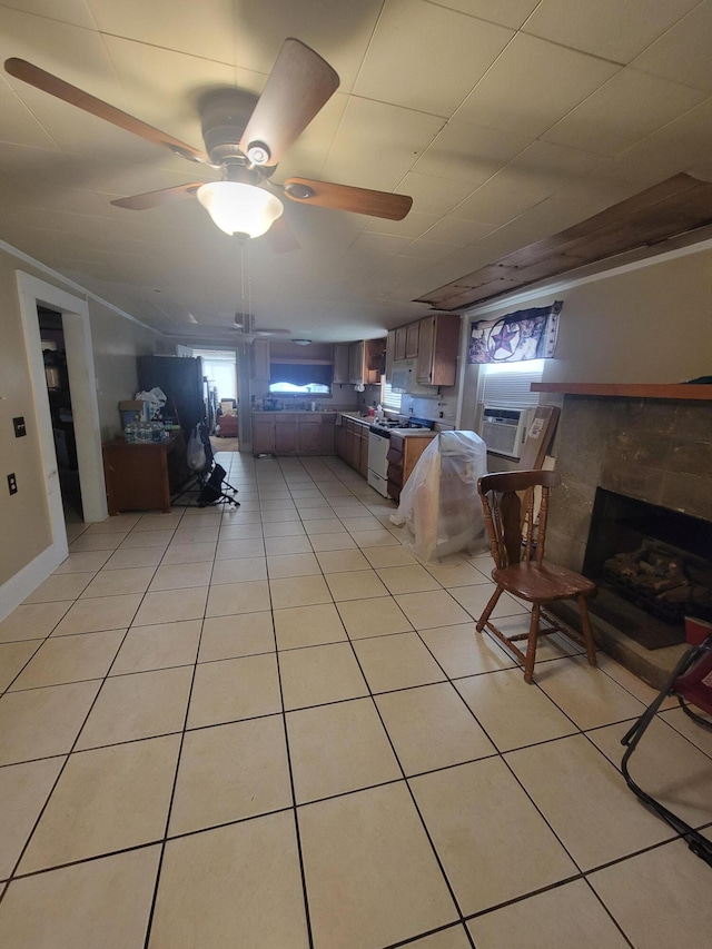 unfurnished living room with cooling unit, ceiling fan, and light tile patterned floors