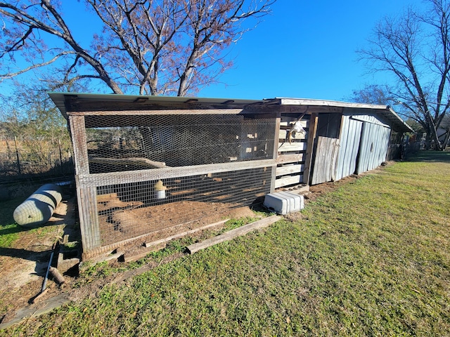 view of outdoor structure with a yard