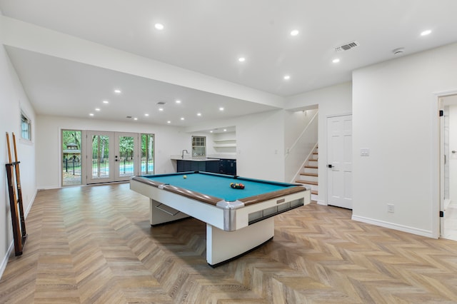 playroom featuring billiards, light parquet floors, and french doors