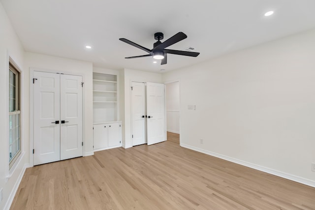 unfurnished bedroom with light wood-type flooring and ceiling fan