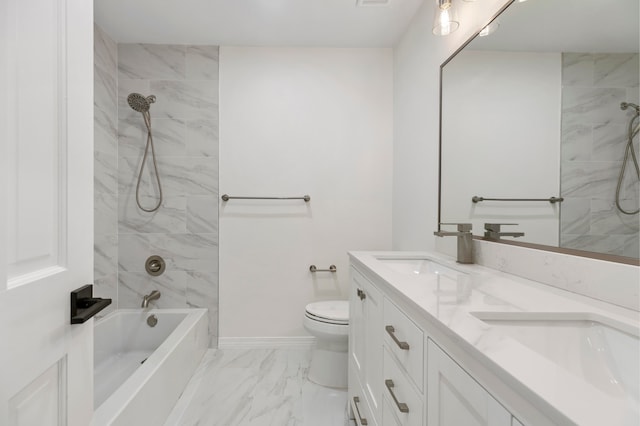 full bathroom featuring tiled shower / bath combo, vanity, and toilet