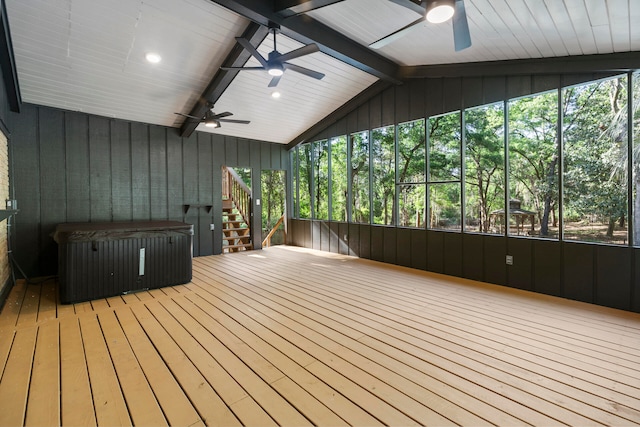 wooden terrace with a hot tub and ceiling fan